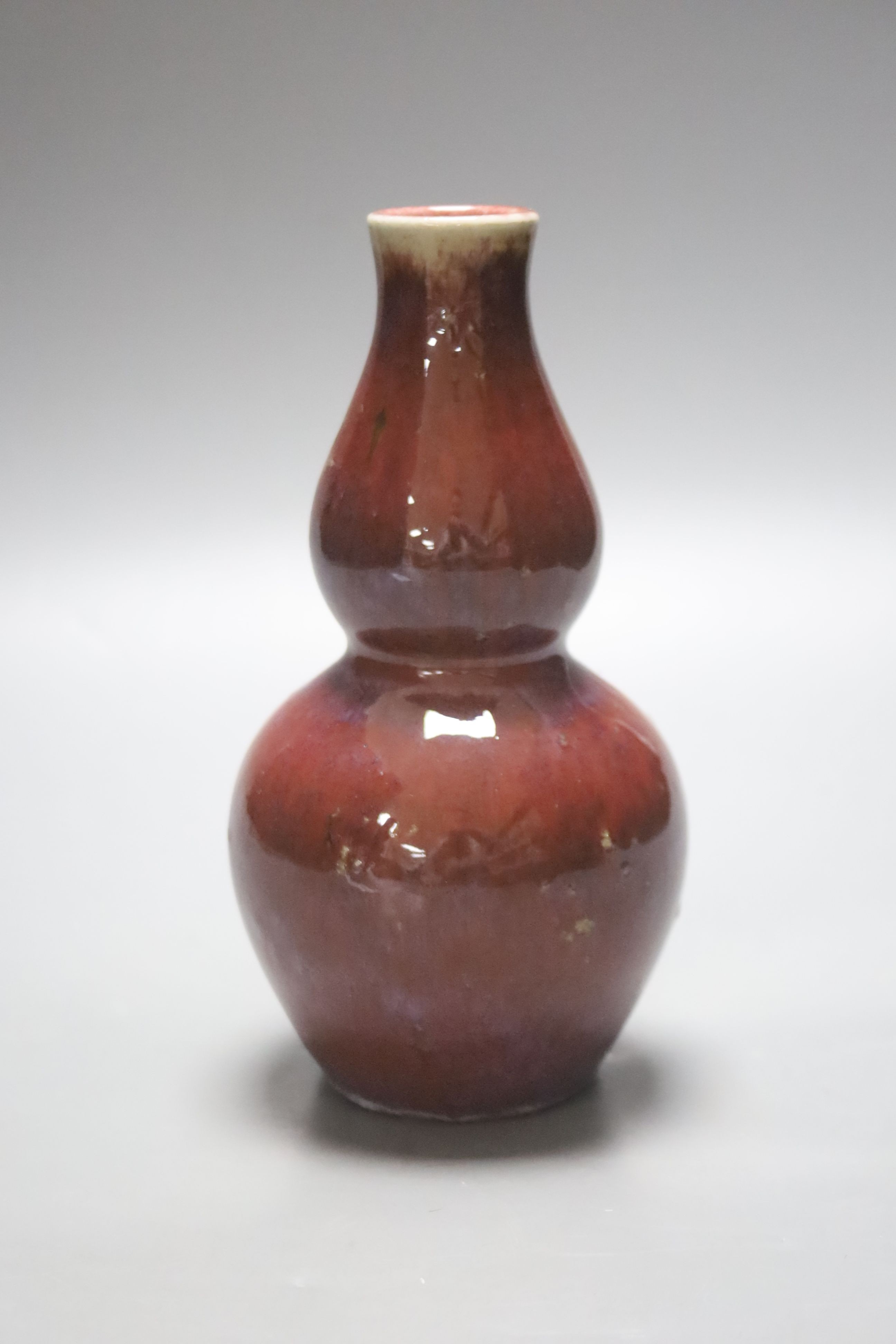 A Chinese flambé double gourd vase, 18cm